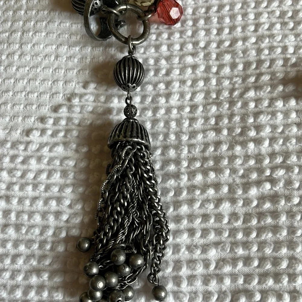 Women’s double chain belt. One of metal objects and the second chain of pearls.